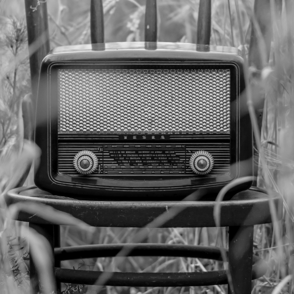 Photo of an old radio sitting on chair