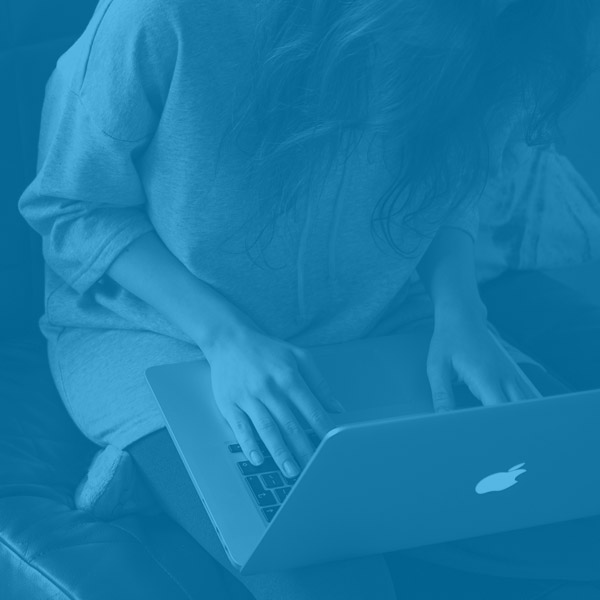 Woman working remotely using a laptop computer